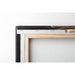 Detail of the back of a stretched canvas with wooden frame and hanger