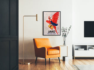 Vintage Jako Cleans Everything advertising poster, framed in a living room with an orange armchair and a floor lamp.