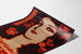 Manifesto pubblicitario vintage Perfumes Griet, esposto su una pagina incurvata, visto in prospettiva.