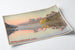 Vintage Swiss poster – Lake Lucerne (Vierwaldstättersee) – Jakob Wyss, presented on a curled sheet, viewed in perspective.