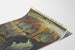 Vintage Grottes de Bétharram poster, presented on a curled sheet, seen in perspective.