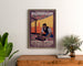 Vintage Mulhouse lithographic exhibition poster, framed above a wooden dresser, between plants.
