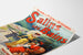 Manifesto vintage Salins les Bains (Jura), presentato su una pagina piegata, visto in prospettiva.
