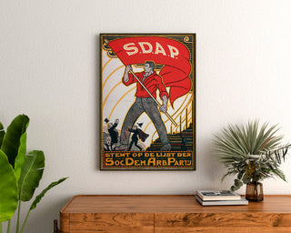 Vintage Stemt SDAP election poster, framed above a wooden sideboard, between plants.
