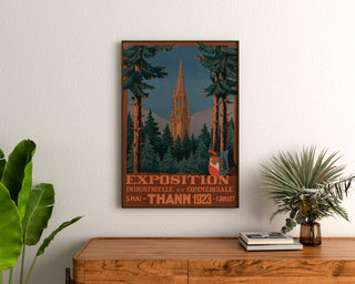 Vintage Thann industrial exhibition poster, framed above a wooden dresser, between plants.