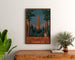 Vintage Thann industrial exhibition poster, framed above a wooden dresser, between plants.