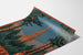 Vintage Thann industrial exhibition poster shown on a curved sheet, viewed in perspective.