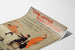 Vintage poster Two Little Vagabonds, shown on a curved sheet, perspective view.